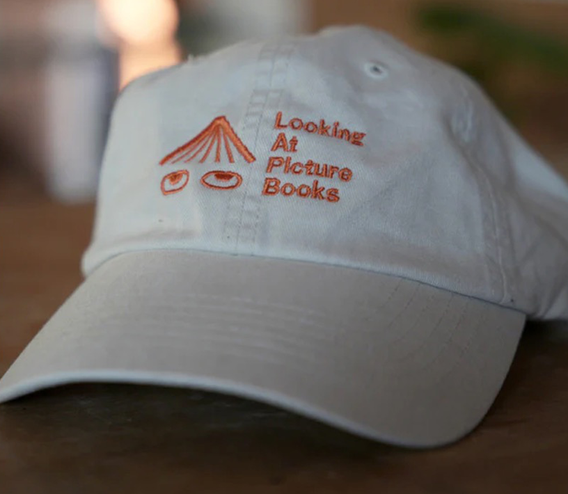 YOUTH Looking At Picture Books Hat