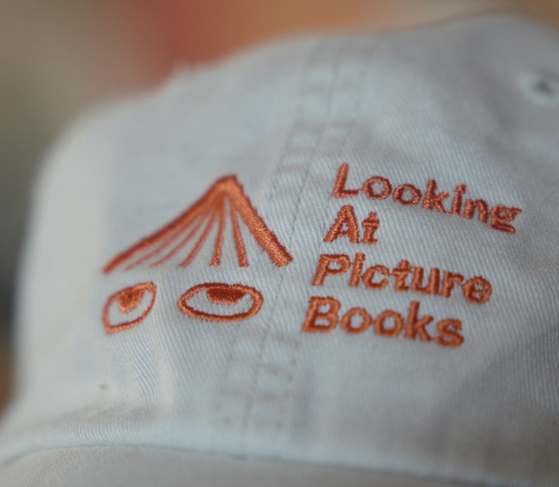 YOUTH Looking At Picture Books Hat